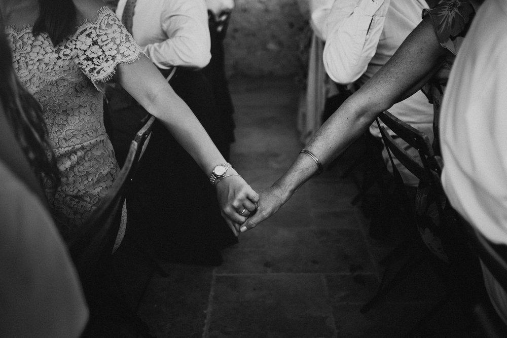 010-holding-hands-at-a-wedding-in-france.jpg