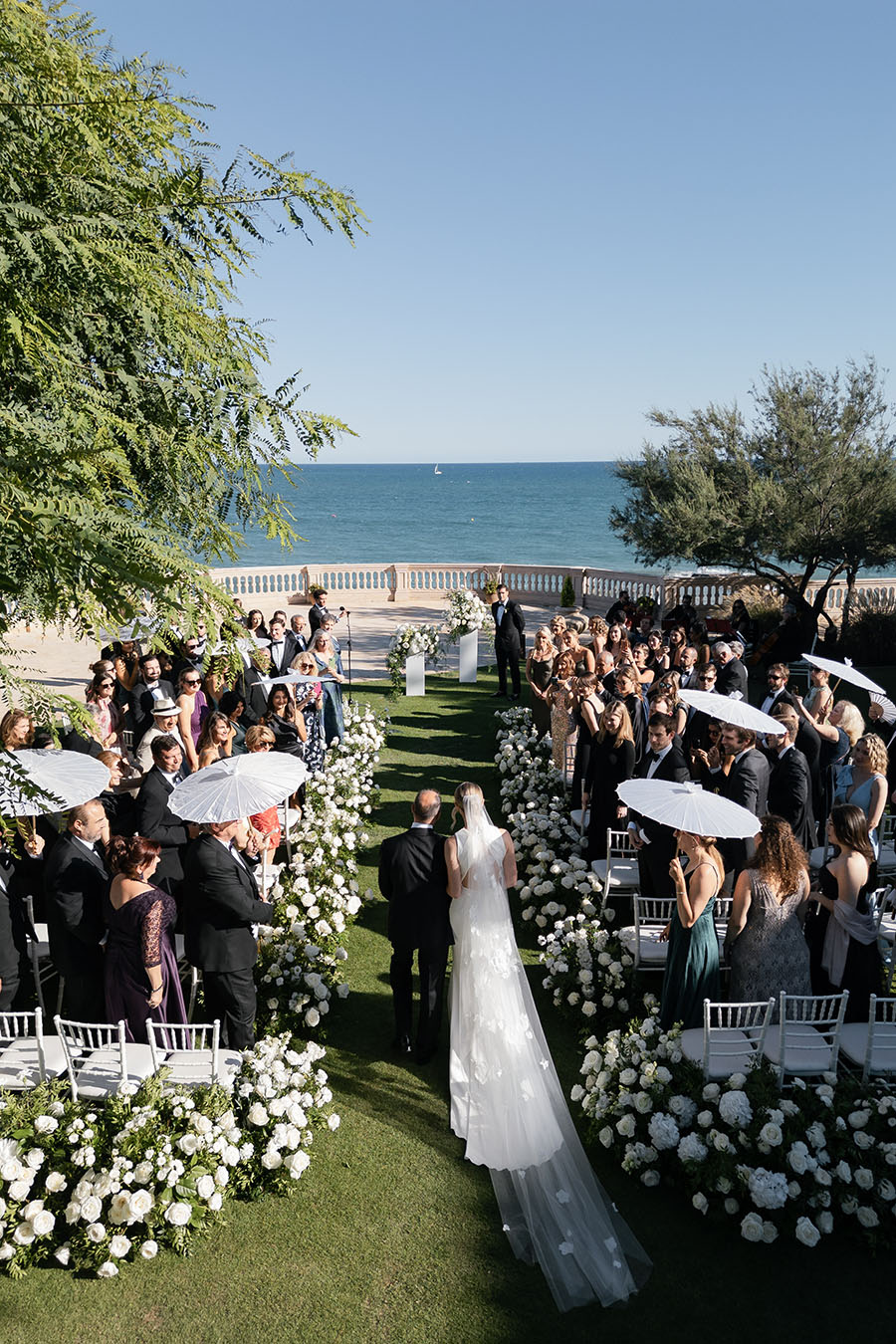 Bride walking down the aisle at her wedding at Xalet del Nin